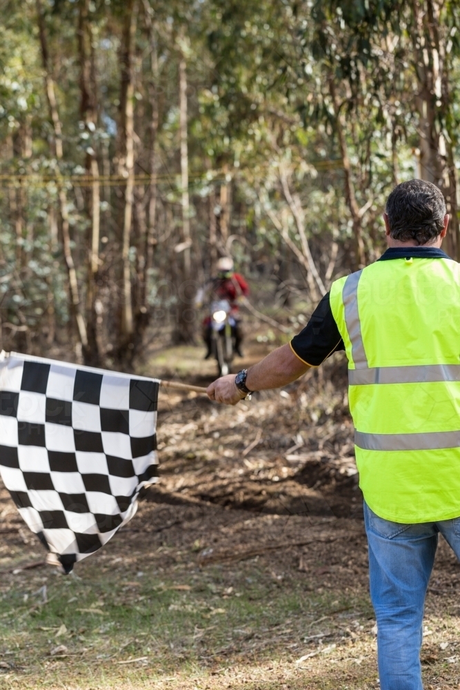 Chequered flag at finish line of motorbike race - Australian Stock Image