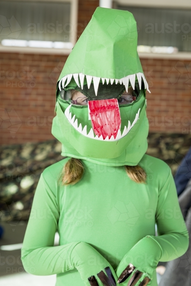 Child in Green Dinosaur Costume - Australian Stock Image