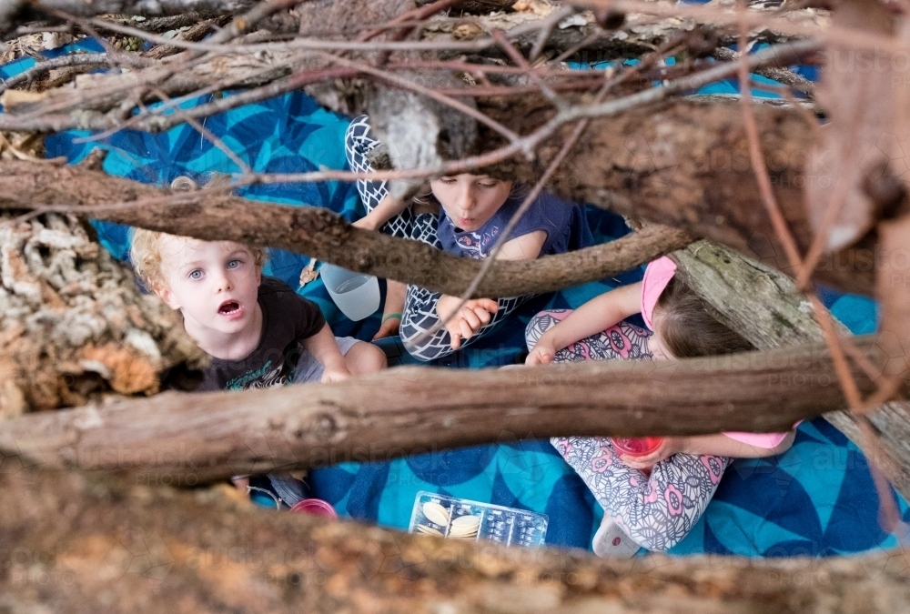 Children playing cubby house in the bush - Australian Stock Image