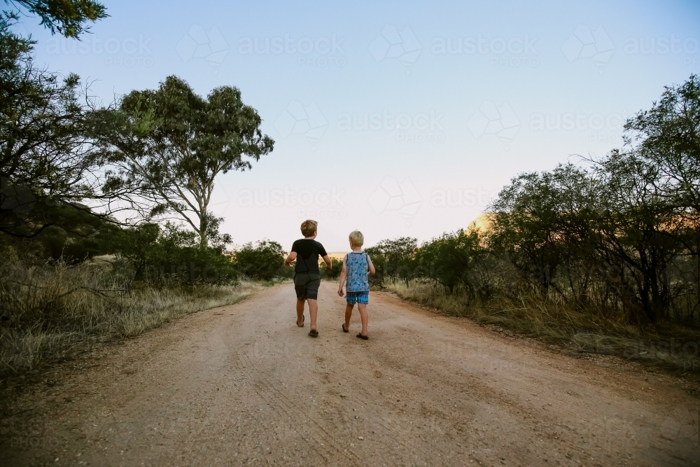 Children walking along bush track at Mount Hope in Central Victoria - Australian Stock Image