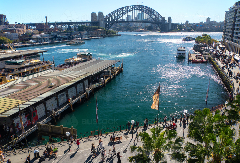 Circular Quay, Sydney, looking down at pedestrians walking along the waterfront - Australian Stock Image