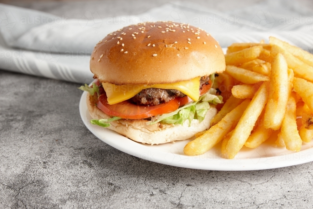 classic beef burger with fenchfries on the side - Australian Stock Image