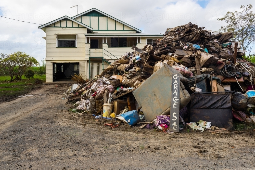 clean up after flooding, funny sign shows Australian humour even during a natural disaster - Australian Stock Image