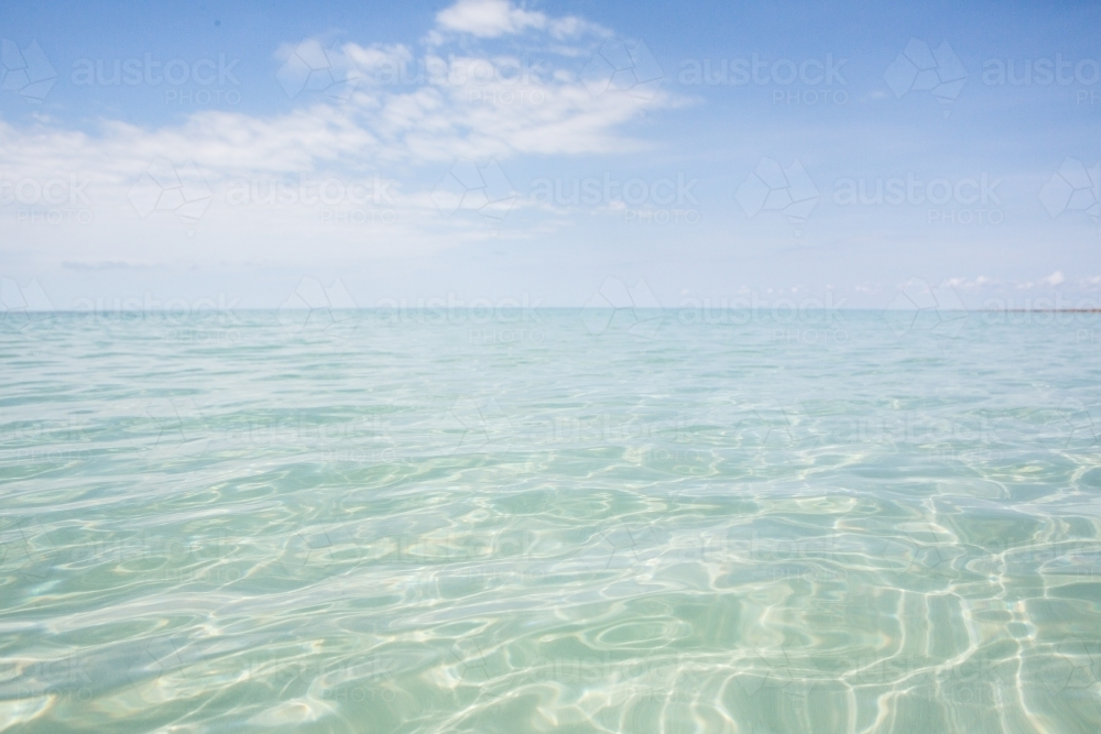 Clear shallow ocean water towards horizon - Australian Stock Image