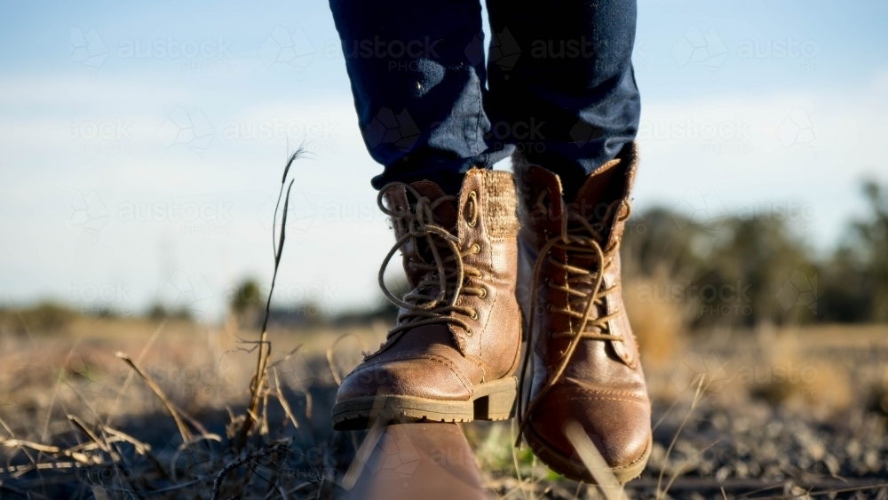 Close of boots on railway track - Australian Stock Image