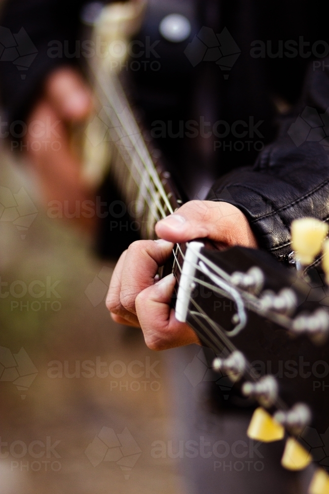 Close up detail of guitar strings and neck - Australian Stock Image