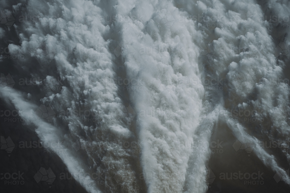 Close up detail of Water flowing from the Hume Dam wall into the Murray River. - Australian Stock Image