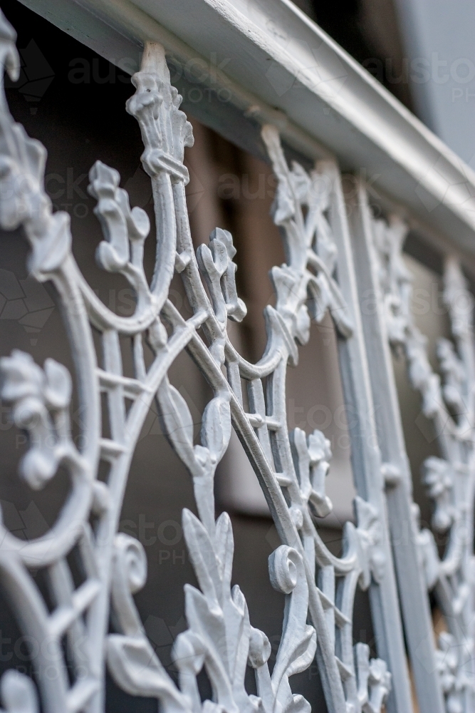 Close up of a decorative cast iron white verandah rail - Australian Stock Image