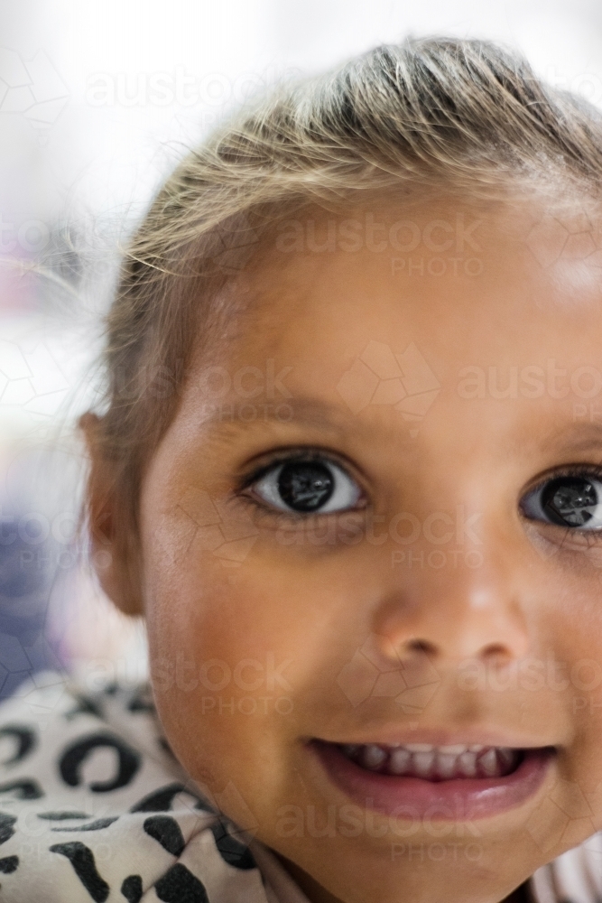 Close-up of a young Aboriginal girl child’s face - Australian Stock Image