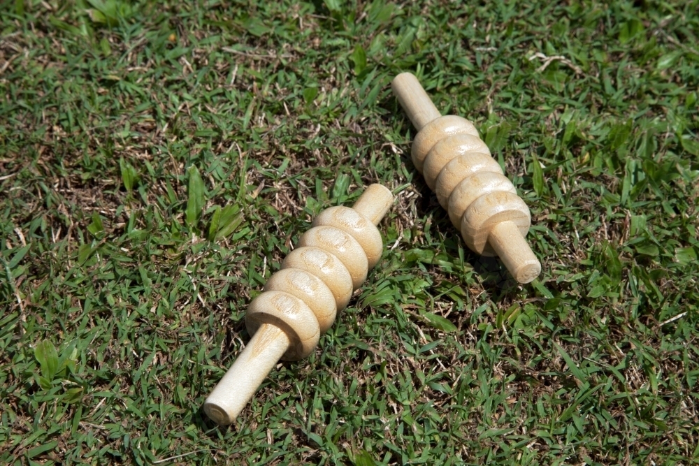 Close up of cricket bails lying on grass - Australian Stock Image