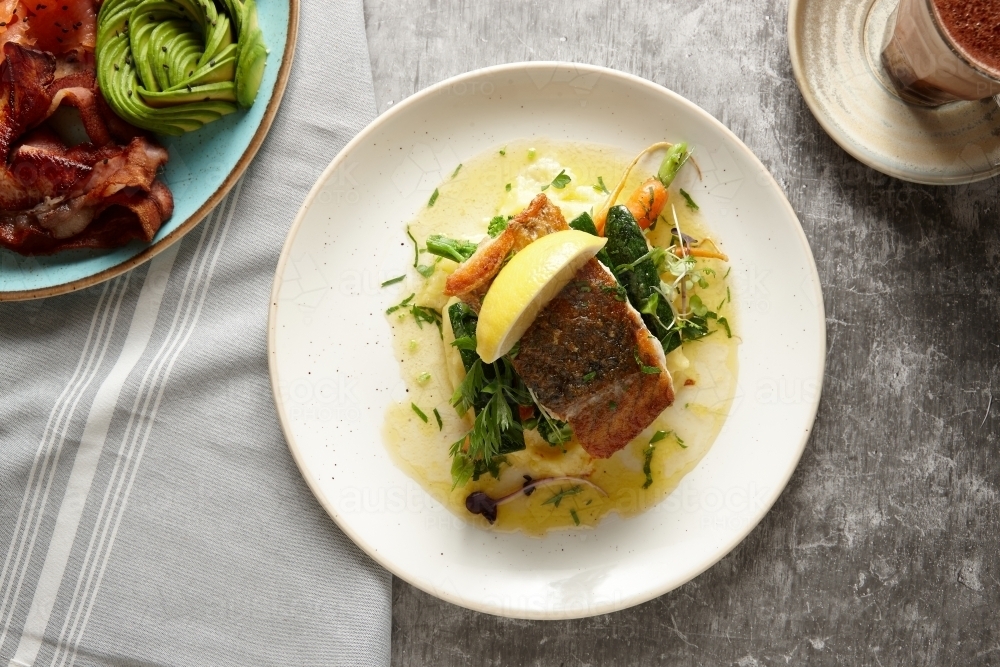 Close up of delicious barramundi dish on plate - Australian Stock Image