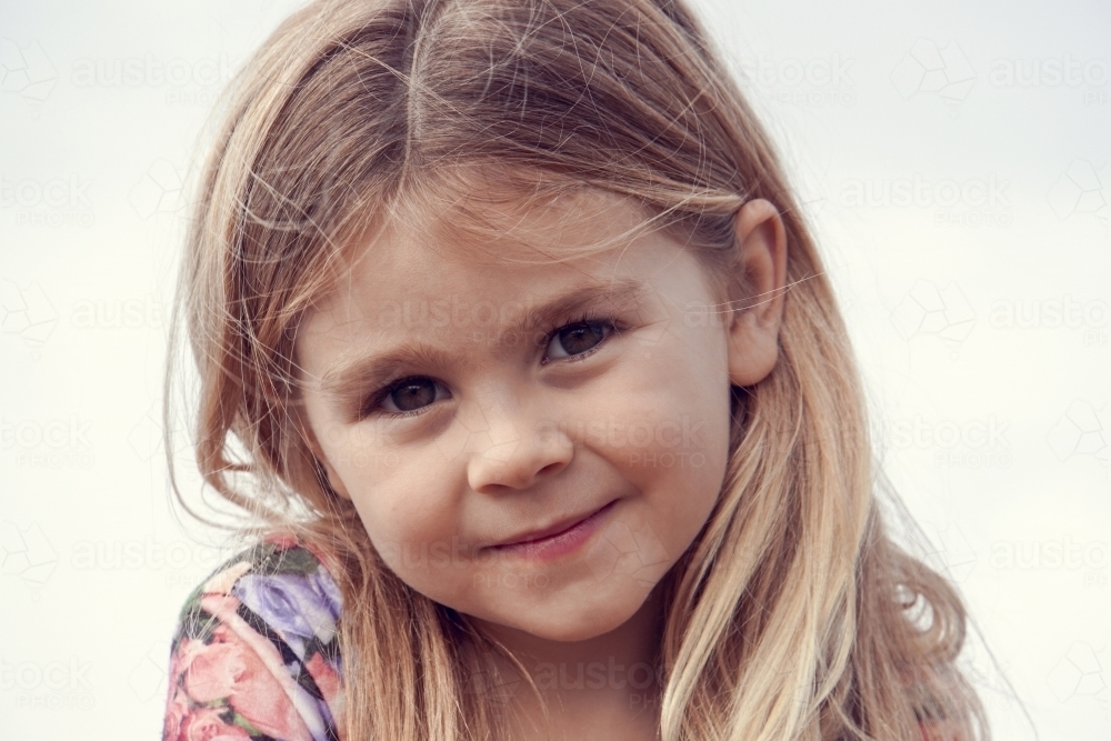 Close up of five year old smiling at camera - Australian Stock Image