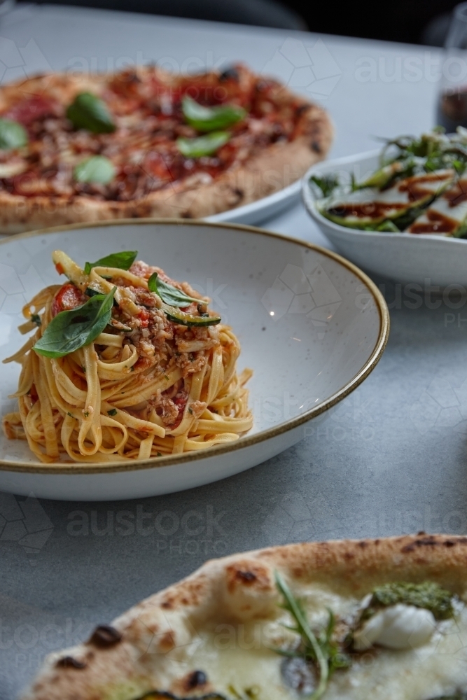 Close up of fresh pasta dish on table - Australian Stock Image