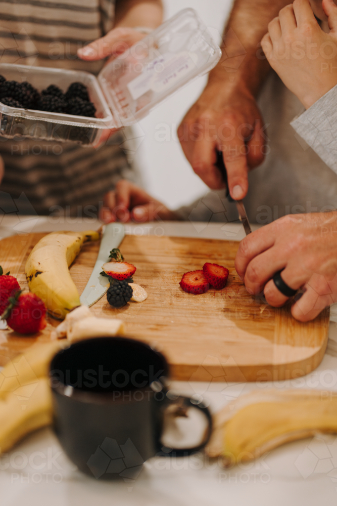 Close-up of fruits cut on the cutting board. - Australian Stock Image