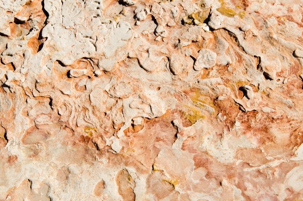 Close up of marbled rock with pink colours - Australian Stock Image