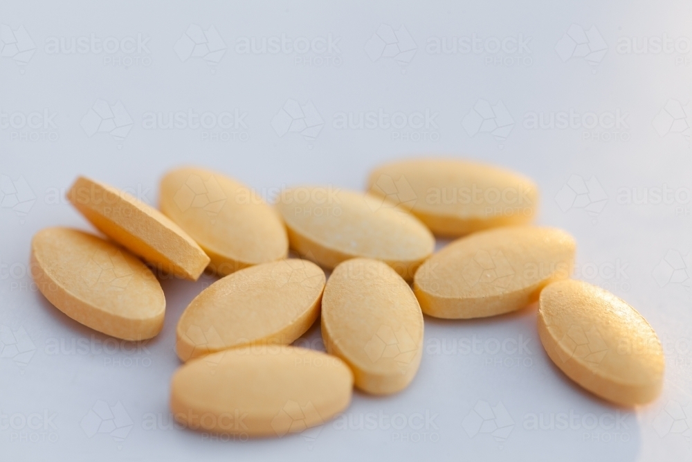 Close up of pile of nausea tablets on white - Australian Stock Image