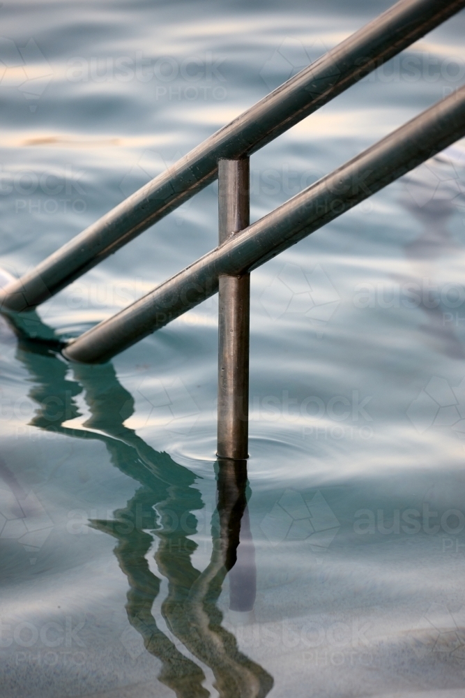 Close-up of sea pool and railings on dusk - Australian Stock Image