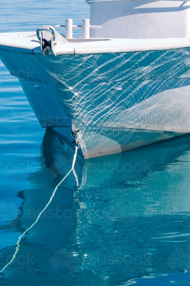 Close-up of the bow of a boat and its reflection - Australian Stock Image