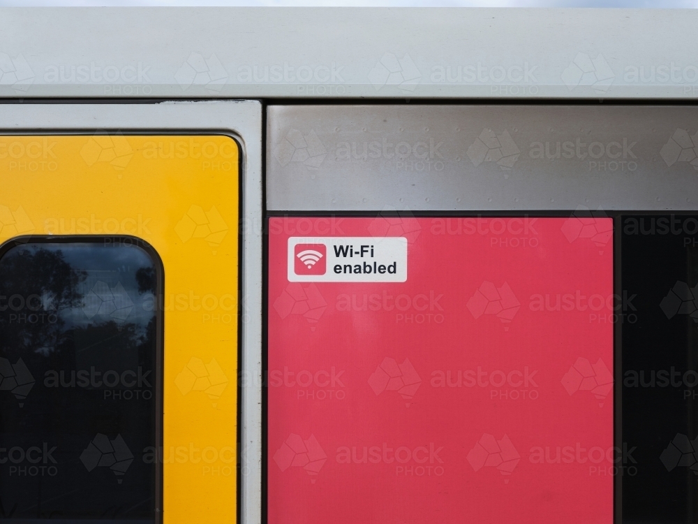 Close-up of train carriage with "Wi-Fi enabled" sign - Australian Stock Image
