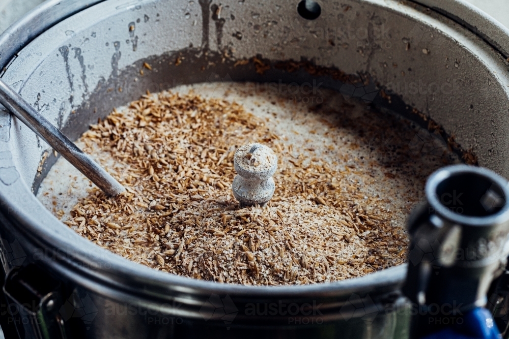 Close up of wheat in beer boiler - Australian Stock Image