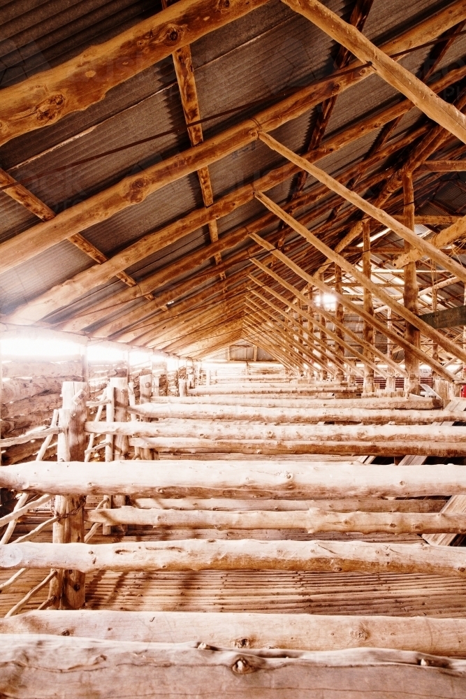 Close up shot of an old fashioned shearing shed with multiple wooden materials to create a divider - Australian Stock Image