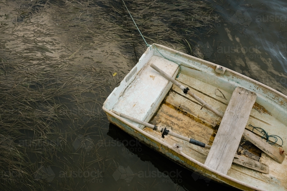 closeup shot of a parked white row boat - Australian Stock Image