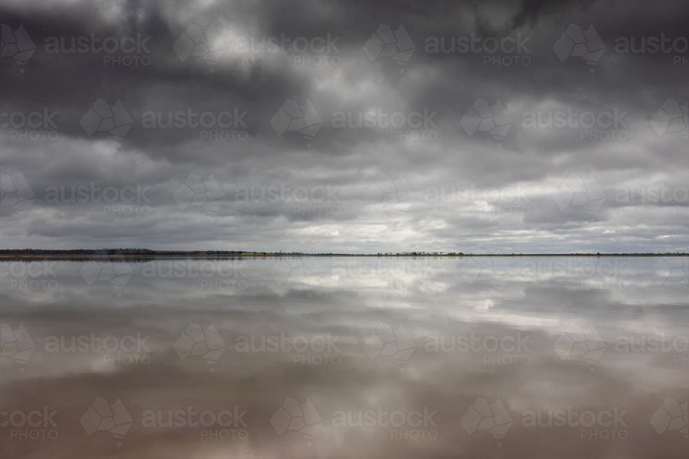 Cloud reflections over lake - Australian Stock Image