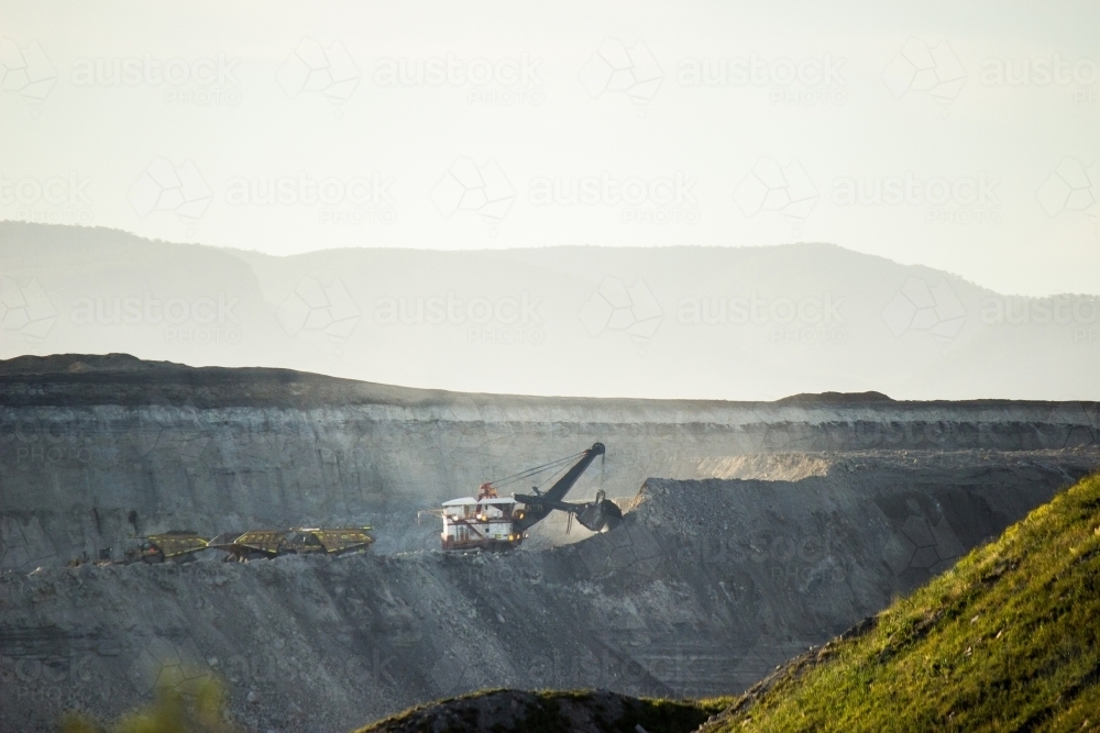 Coal Mining machinery digging in an open cut mine - Australian Stock Image