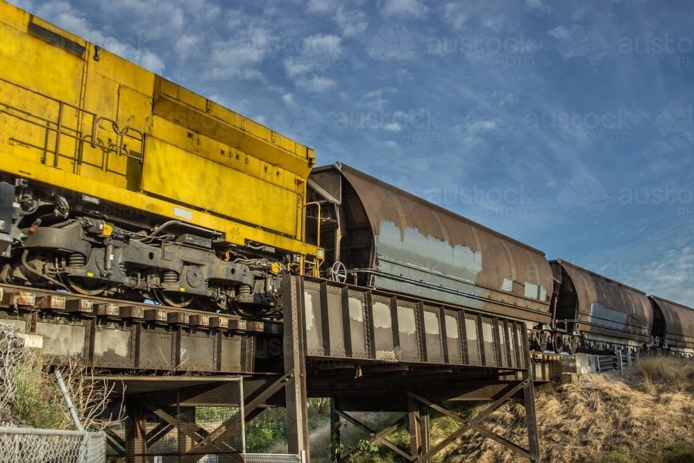 Coal trains hauling coal and crossing a bridge - Australian Stock Image