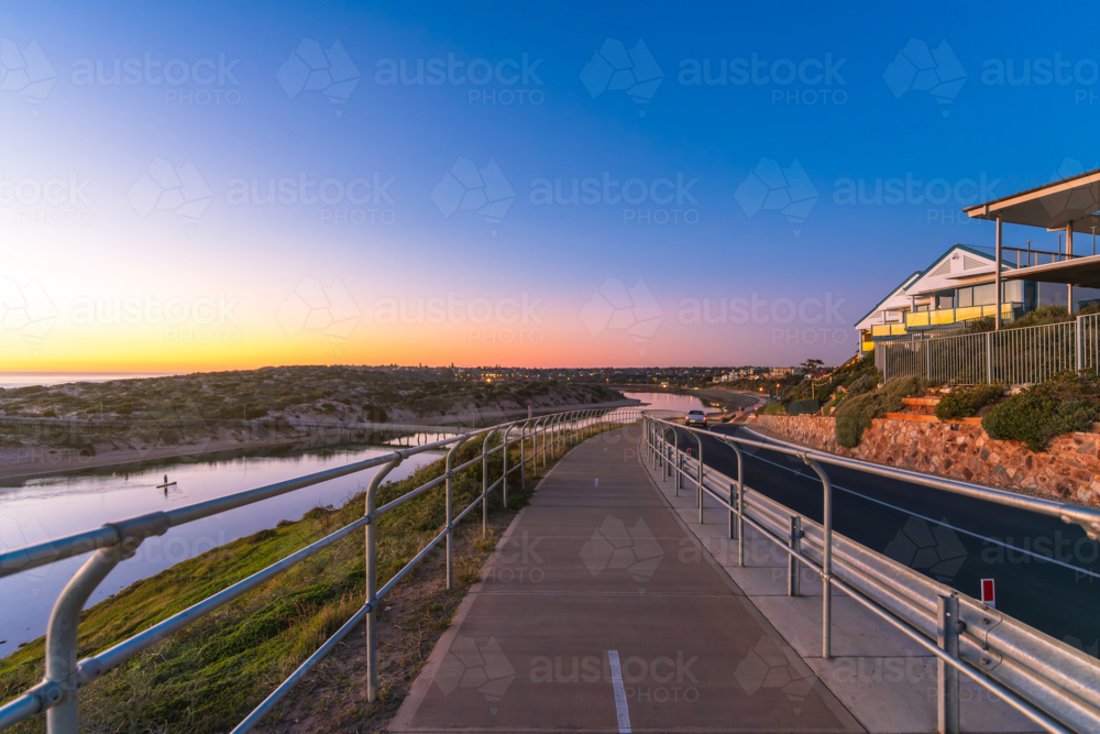 Coastal Drive in Port Noarlunga with shared footpath and bike track along the Onkaparinga River - Australian Stock Image