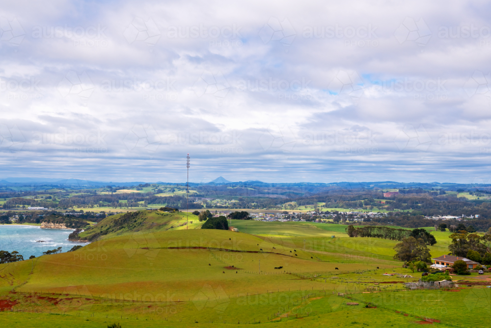 Coastal rural valley landscape with hills in the distance, Tasmania - Australian Stock Image