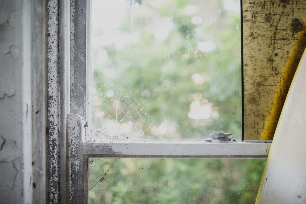 cobwebs on windowsill in old home - Australian Stock Image