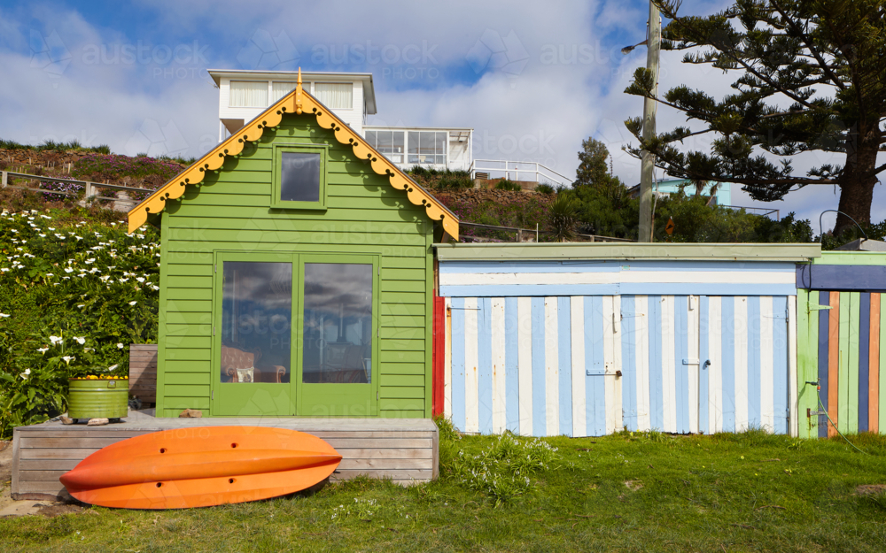Colourful beach shack and kayak in NW Tasmania - Australian Stock Image