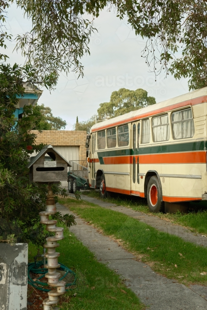 Colourful bus in urban driveway - Australian Stock Image