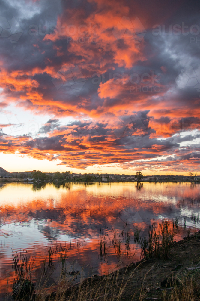 Colourful sunset over a country dam - Australian Stock Image