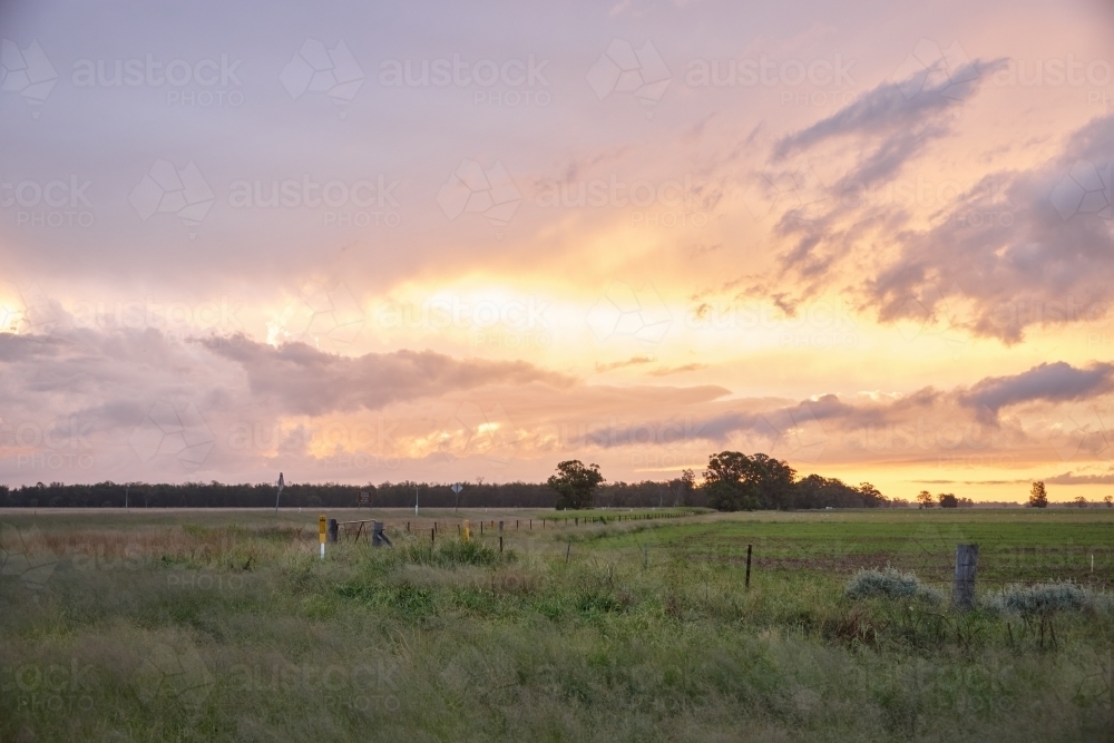 Colourful sunset over farmland - Australian Stock Image