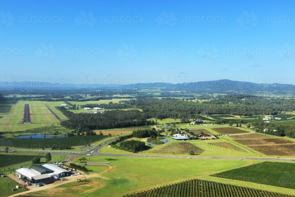 Coming in to Cessnock airport over green vineyards - Australian Stock Image