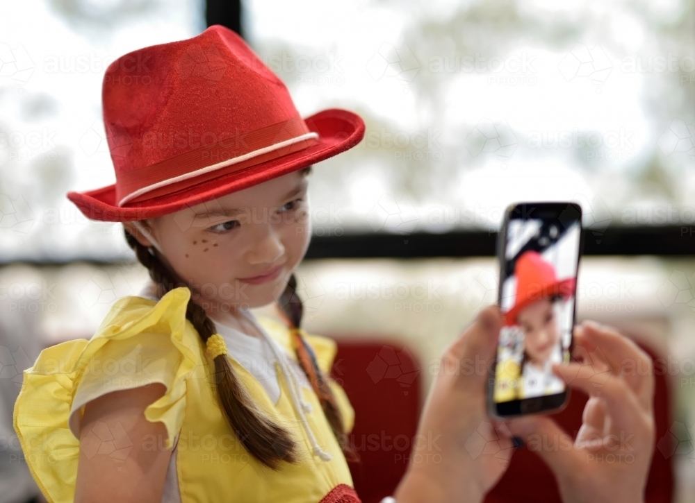 Concert Rehearsal for a school play taking a photo with a mobile phone - Australian Stock Image