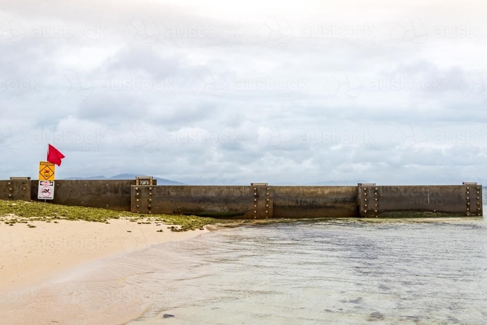 Concrete Breakwall on Beach - Australian Stock Image