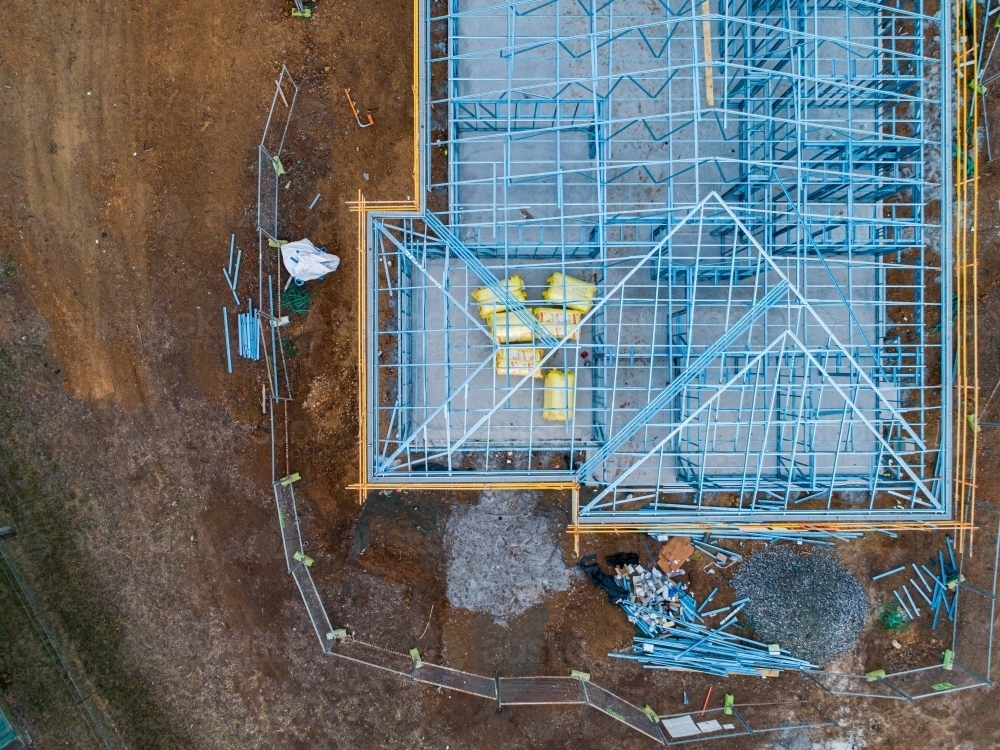 Concrete slab & metal framework of residential house under construction - Australian Stock Image