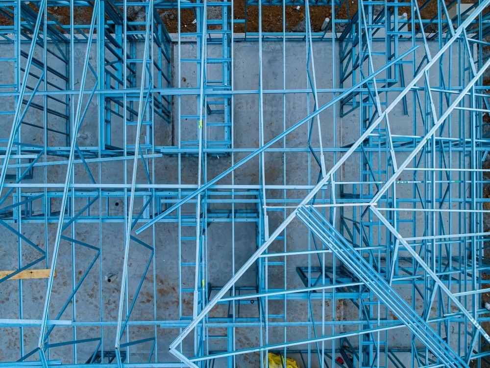 Concrete slab & metal framework of residential house under construction - Australian Stock Image