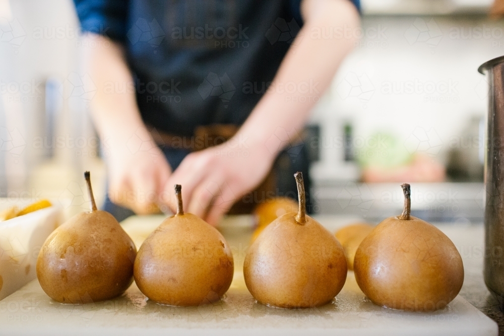 Cooked pears in cafe kitchen - Australian Stock Image