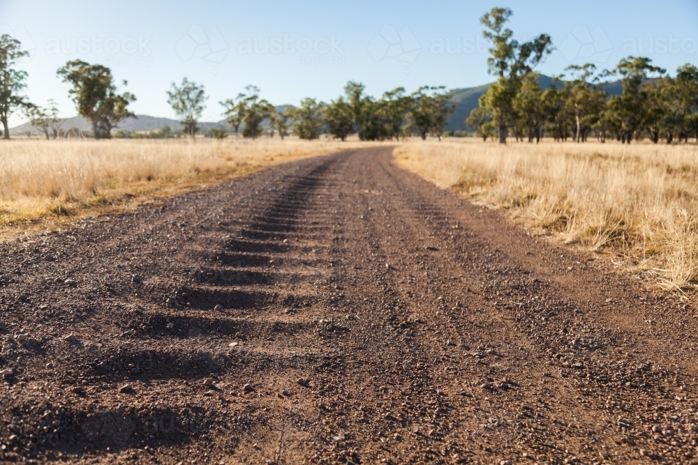 Corrugated gravel and dirt road driveway on farm - Australian Stock Image