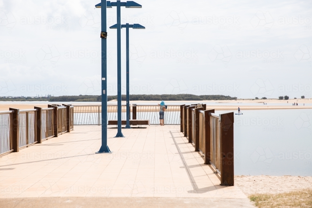 Cotton Tree jetty in the sun - Australian Stock Image