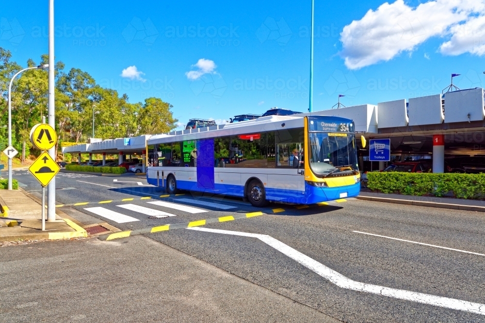 Image of Council bus driving across pedestrian crossing on sealed roads ...