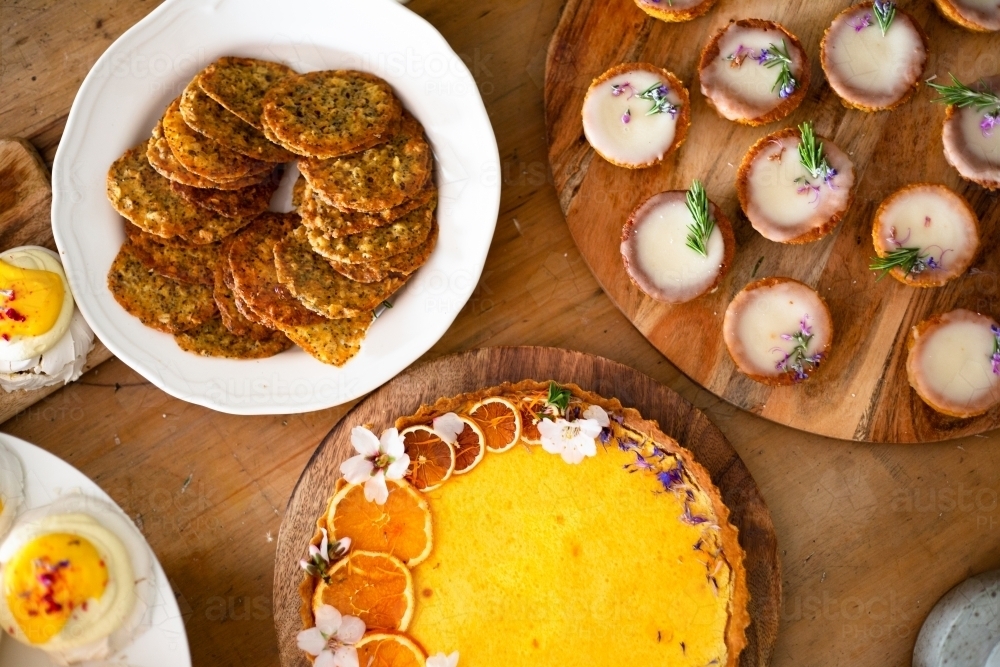 Country table filled with desserts for gathering - Australian Stock Image