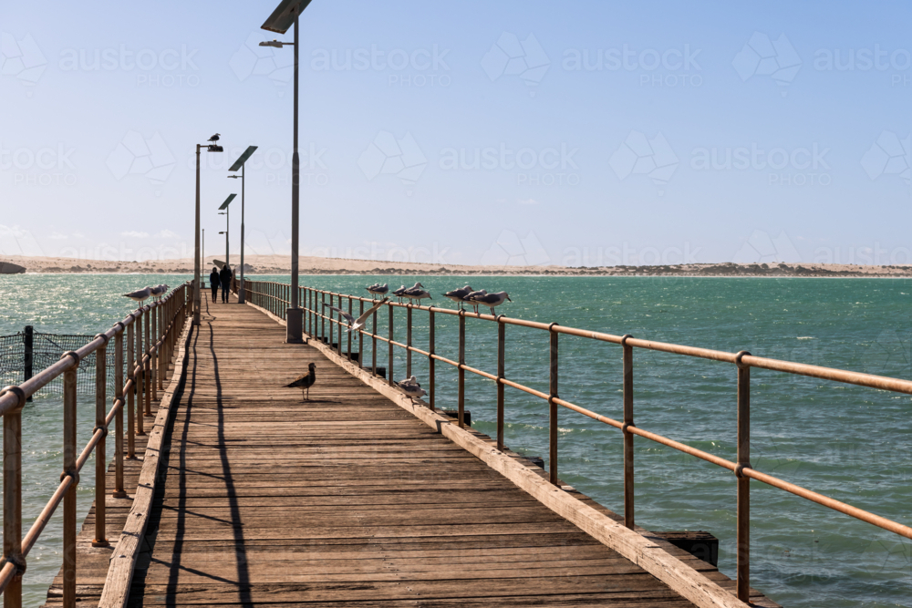 Couple walking on jetty at Cactus Beach, South Australia - Australian Stock Image