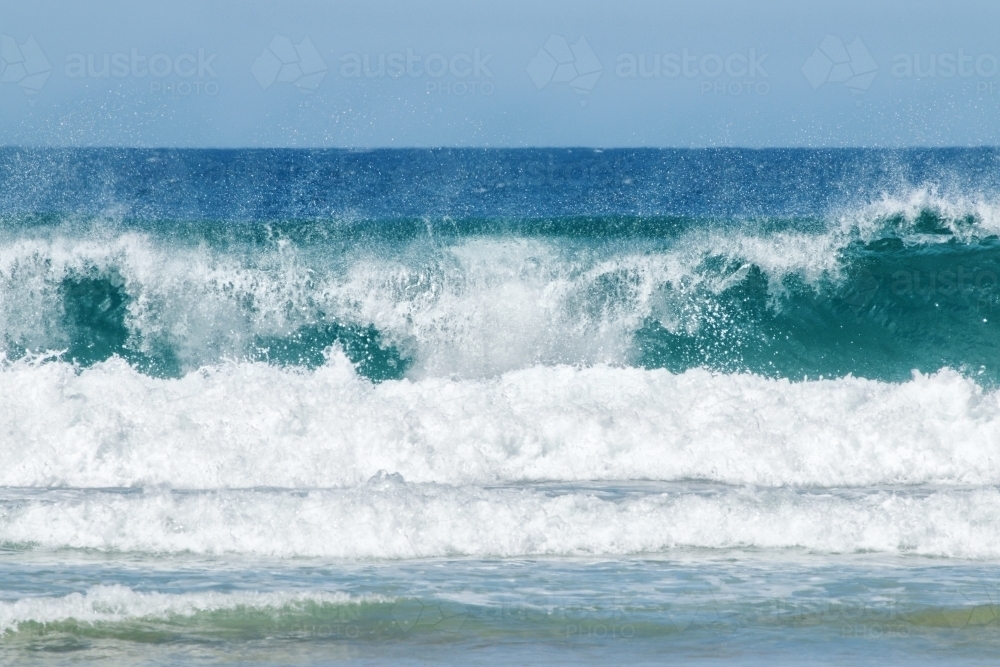 Crashing wave with spraying water - Australian Stock Image