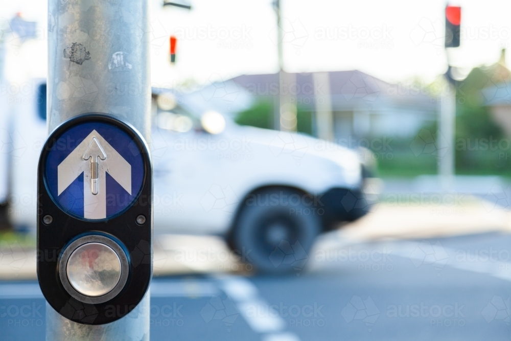 Crosswalk button at pedestrian crossing at traffic light - Australian Stock Image