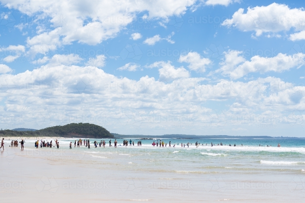 Crowd at Narrawallee beach on a summers day - Australian Stock Image